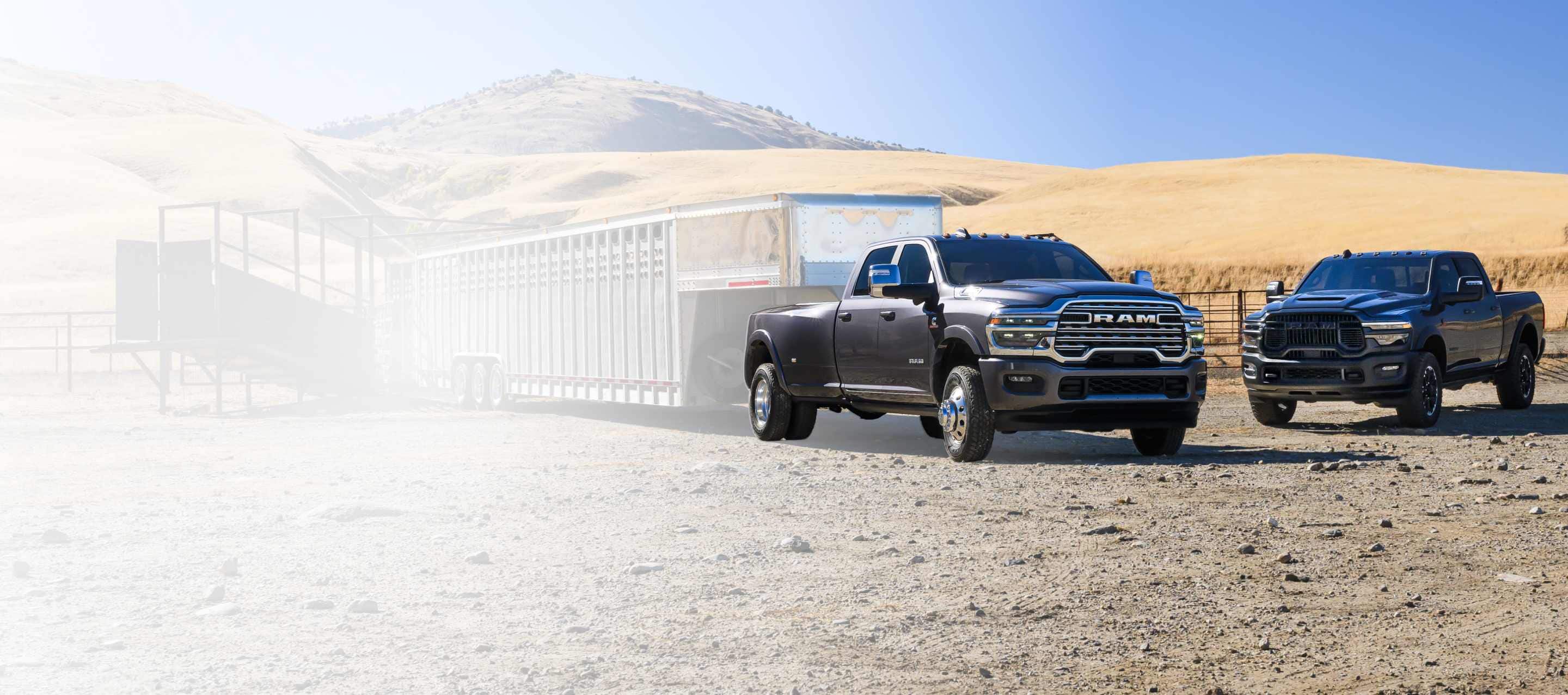 A gray 2026 Ram 1500 Limited 4x4 Crew Cab traveling down a country road. Labor Day Sales Event and 10YR/100000mi.