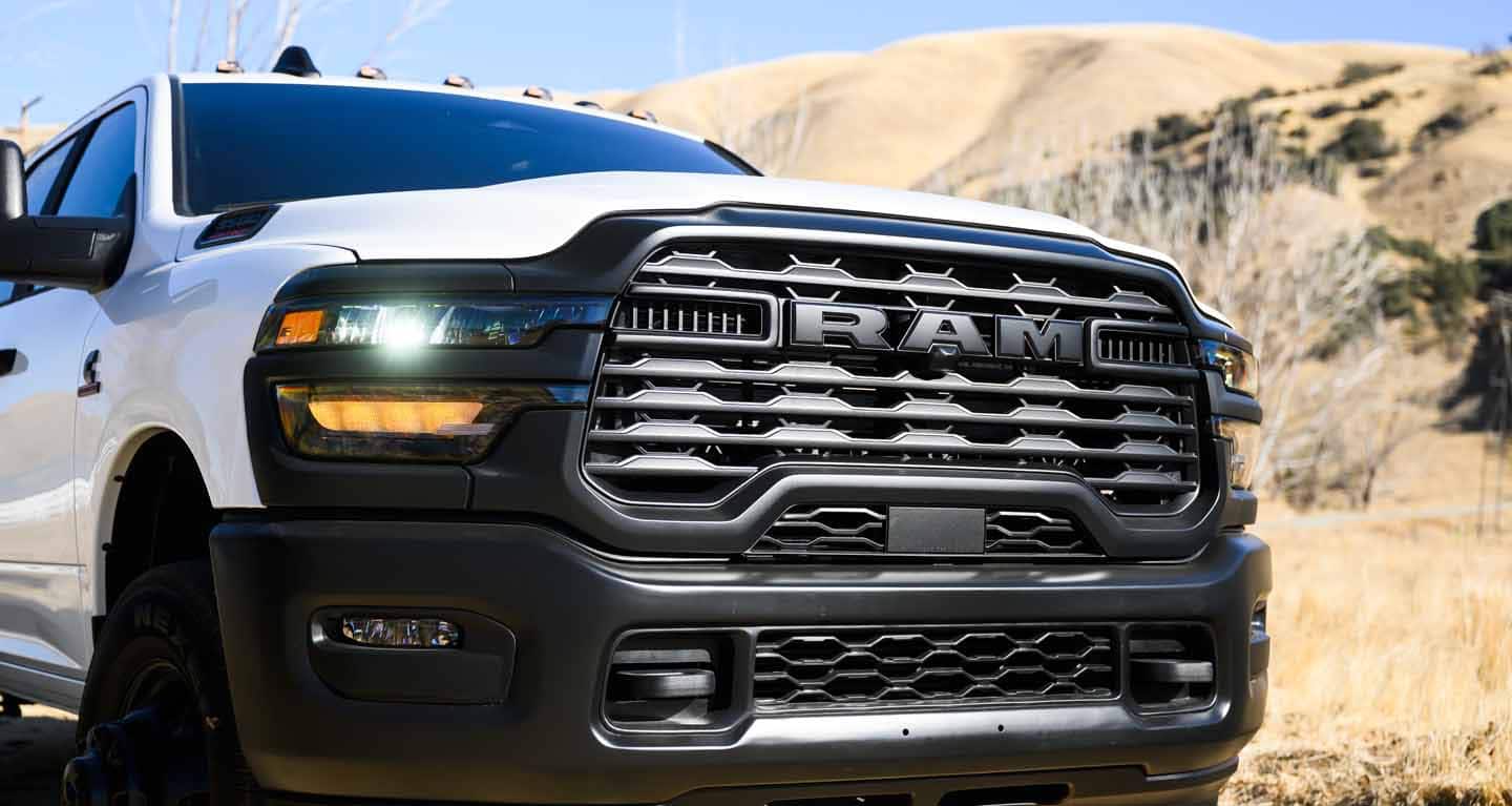 Display The front end of a white 2026 Ram 3500 Tradesman Chassis Cab Crew Cab.
