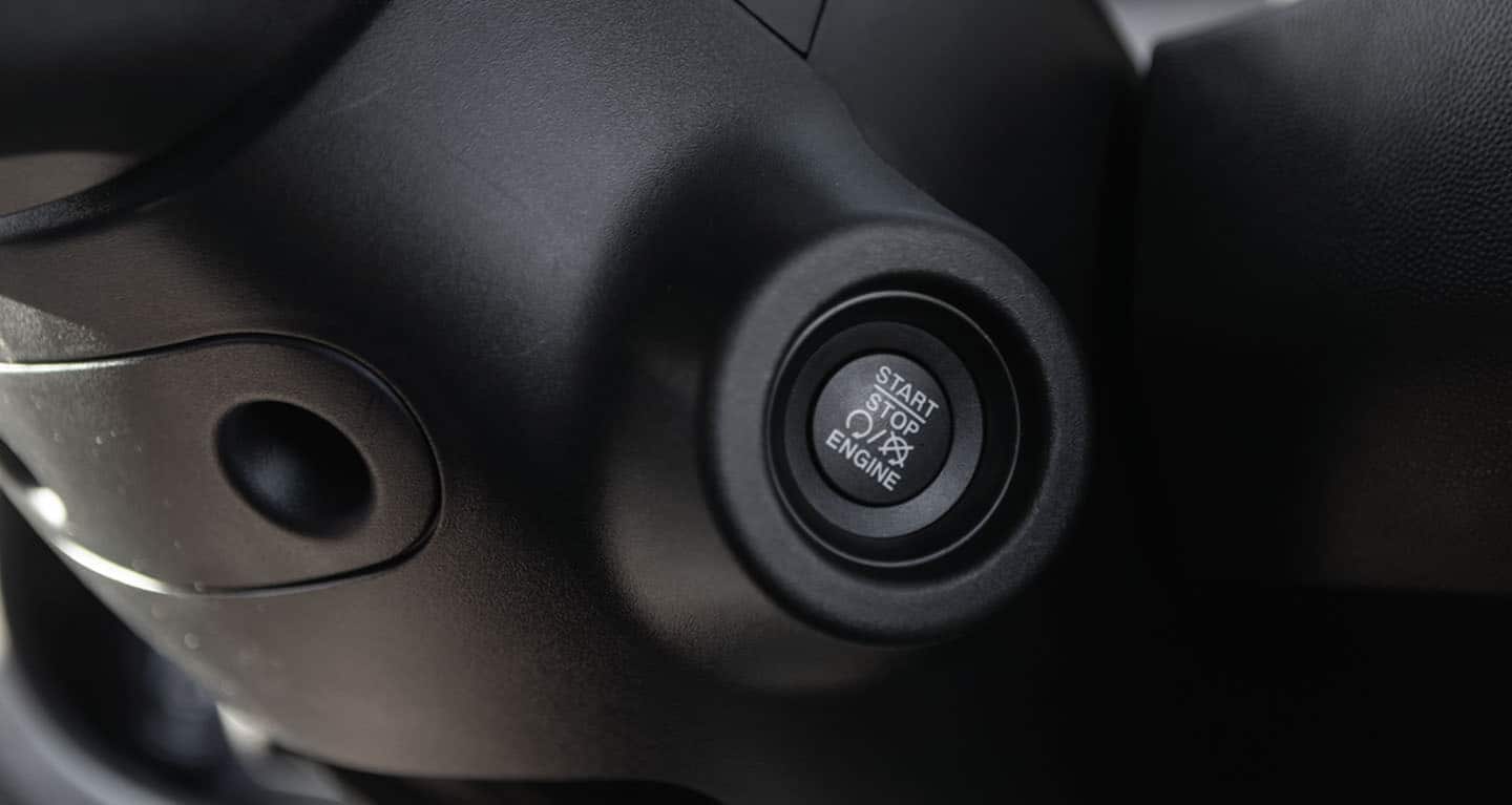 Display The start/stop ignition button on the steering column in the 2026 Ram ProMaster EV 3500 Cargo Van.