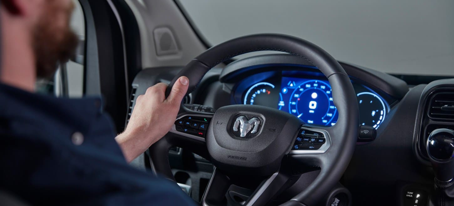 Display The interior of the 2026 Ram ProMaster focusing on the steering wheel and Digital Cluster Display.