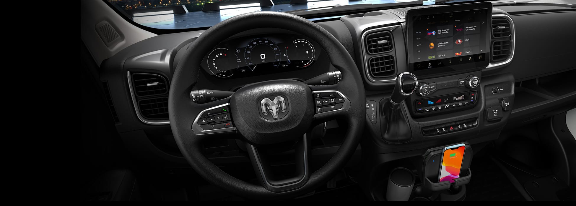 The steering wheel, Digital Cluster Display and Uconnect touchscreen in the 2026 Ram ProMaster.