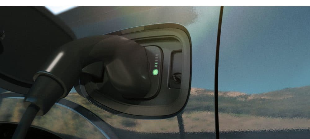 Charging cable plugged into the Ram 1500 REV charge port