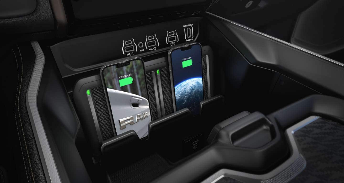 The RamBox Cargo Management System with its lid open on a red 2027 Ram 1500 Tungsten 4x4 Crew Cab
