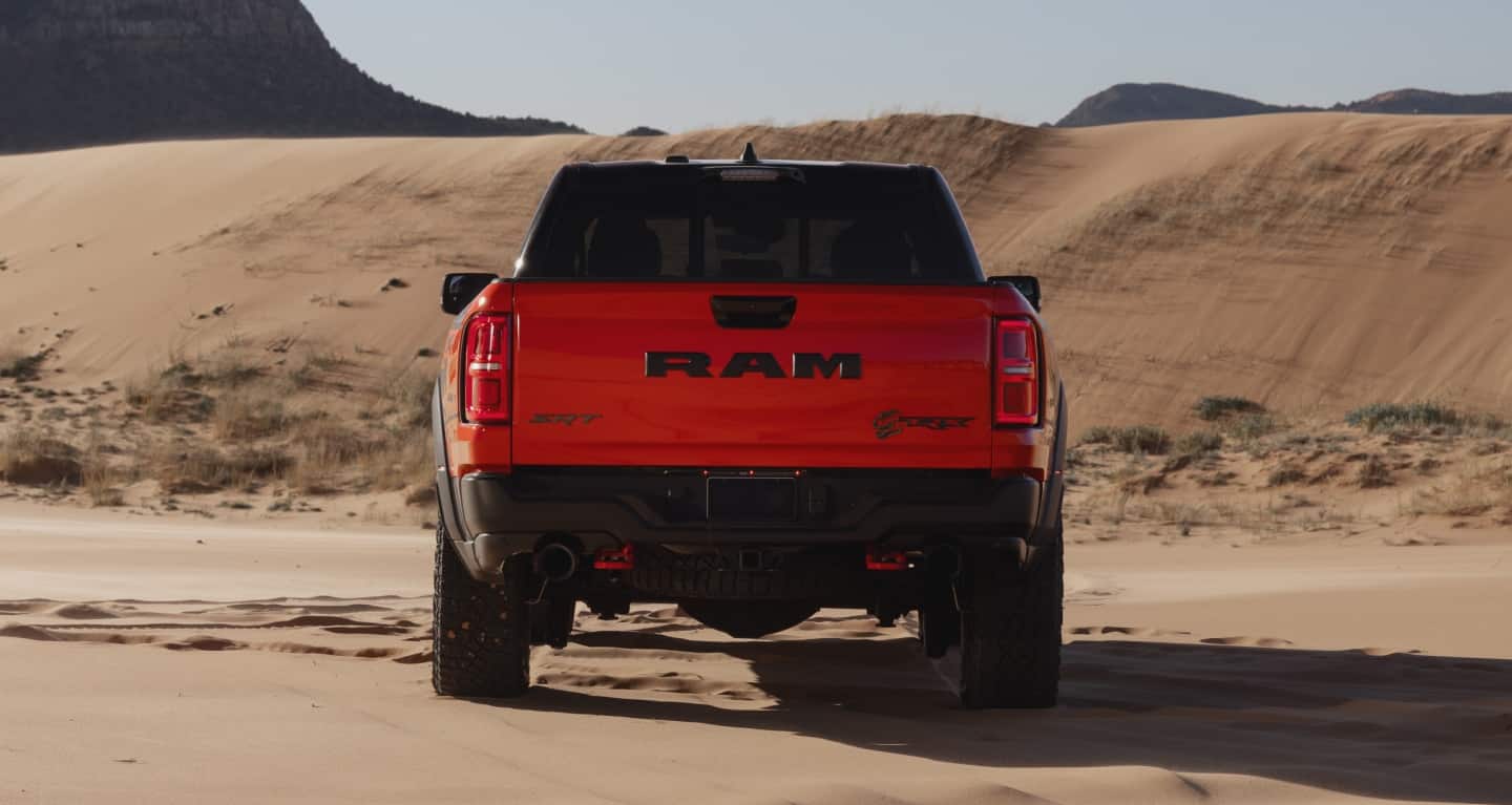 Display The rear of a red 2027 Ram 1500 TRX SRT.