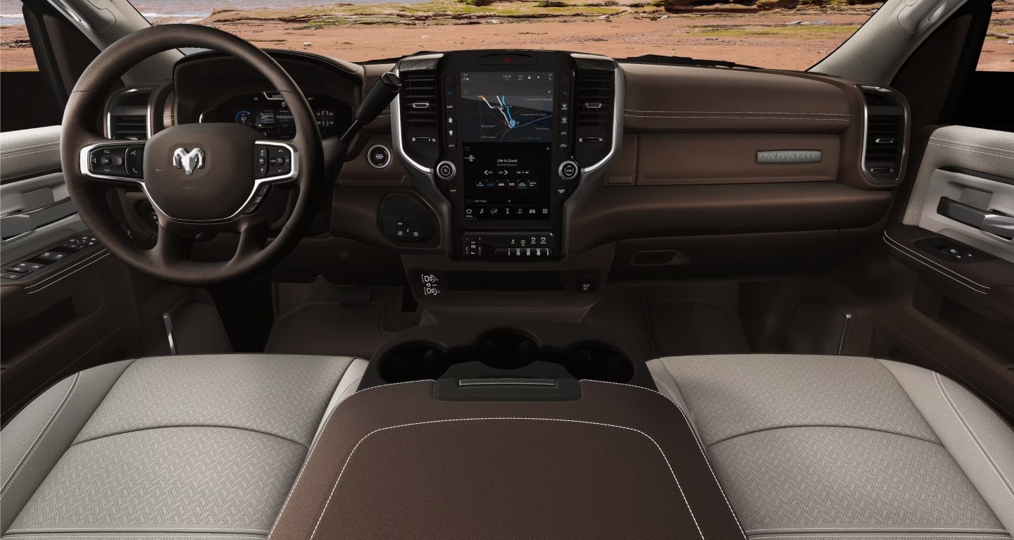 The dashboard and Uconnect 5 touchscreen inside a 2027 Ram 2500 Laramie