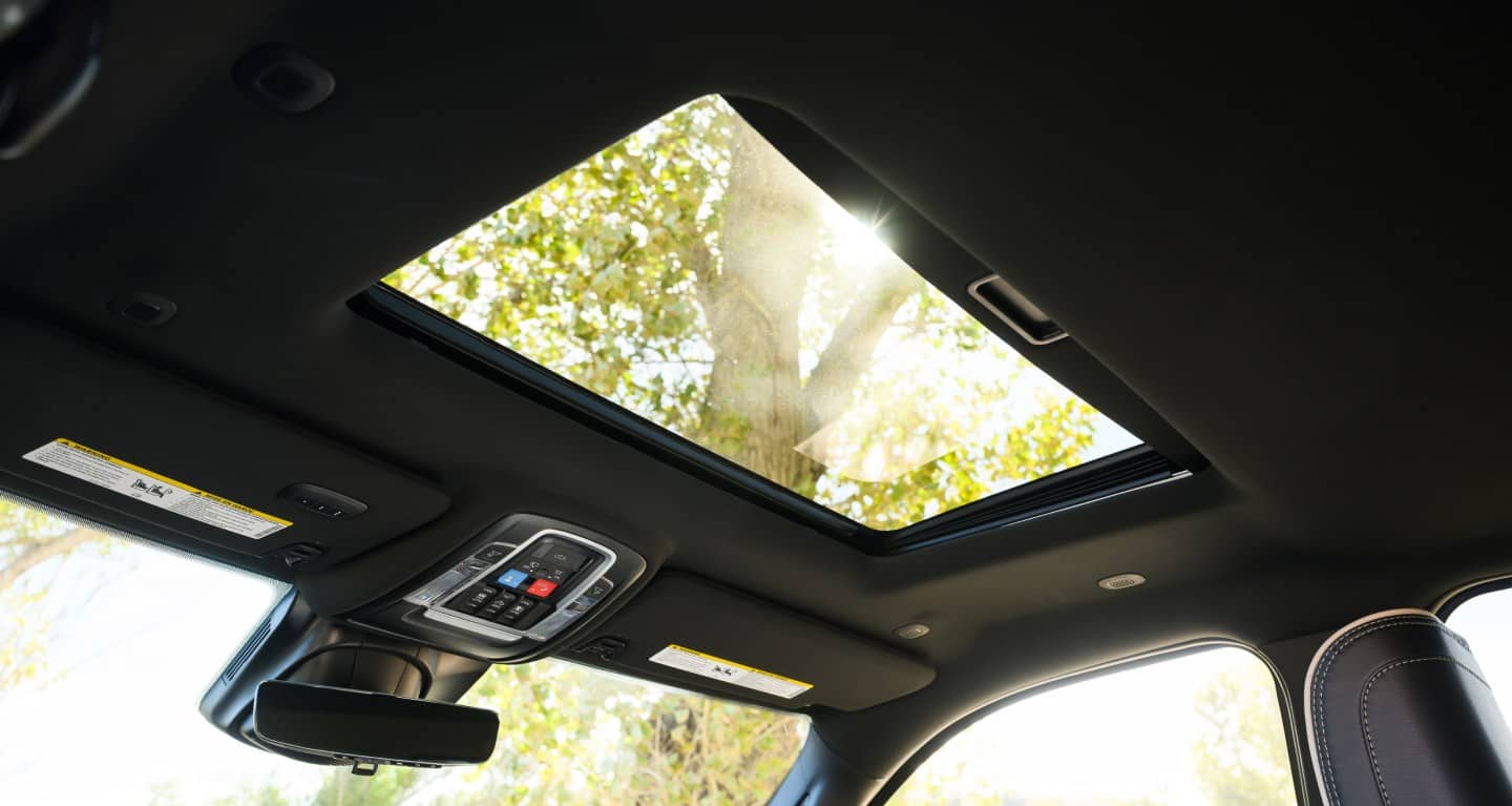 The panoramic sunroof and overhead console inside a 2027 Ram 2500 cabin