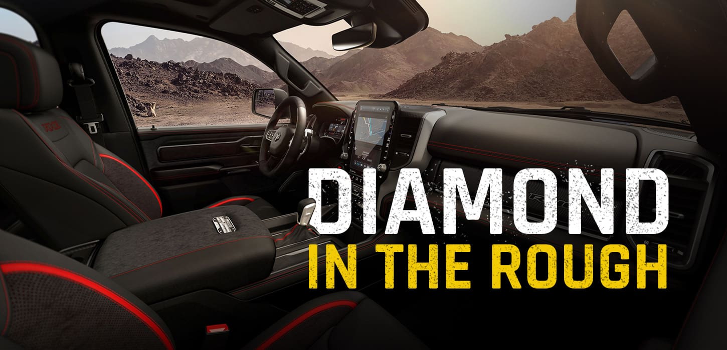 The front row of the 2027 Ram 1500 RHO 4x4 Crew Cab with the sunroof open, shot from the passenger side. Diamond In The Rough.