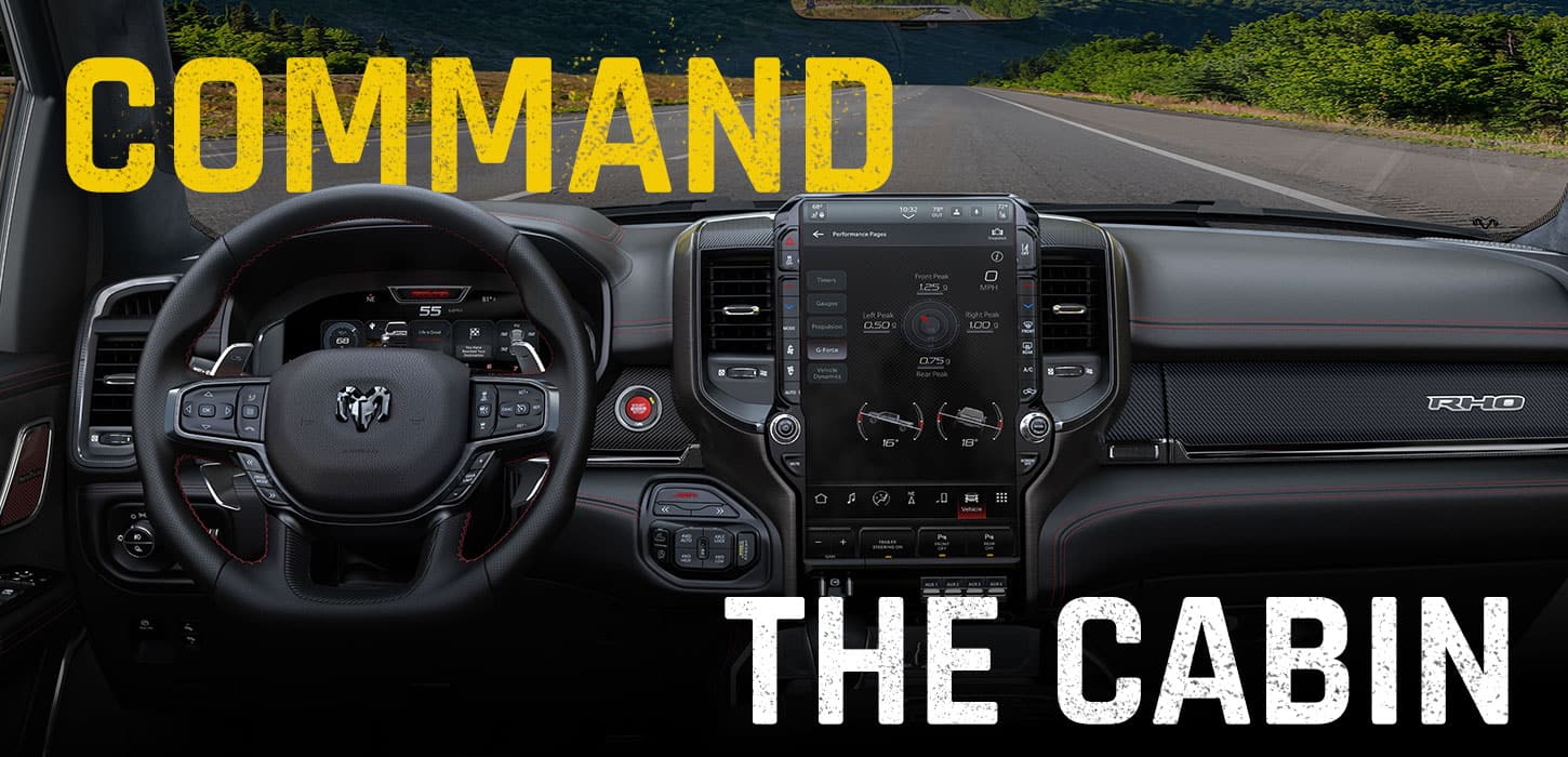 The interior of the 2027 Ram 1500 RHO 4x4 Crew Cab, focusing on the steering wheel, Digital Cluster Display, Uconnect touchscreen and center stack controls. Command The Cabin.