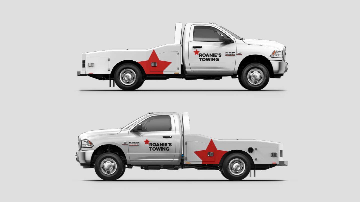 Display Two views of a Ram Chassis Cab with custom graphics for a towing business.