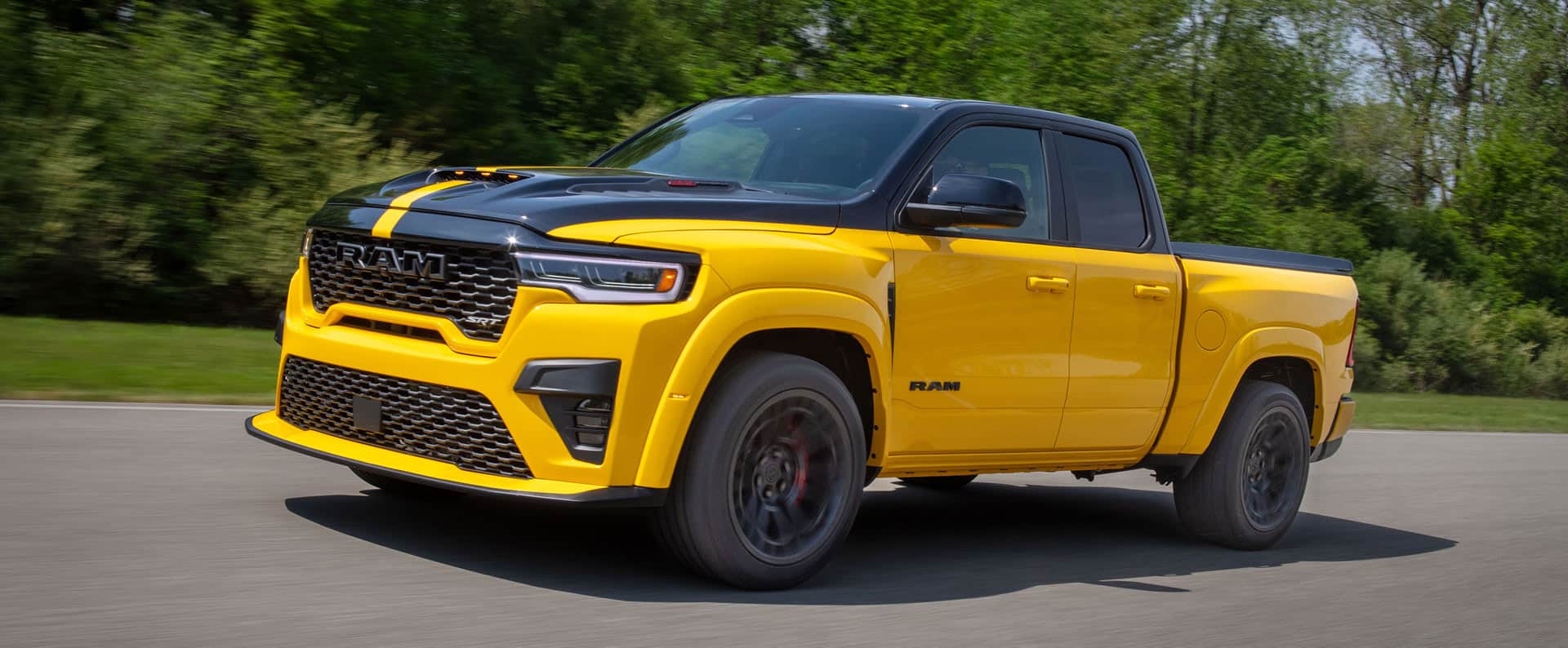 A yellow 2027 Ram 1500 Rumble Bee SRT.