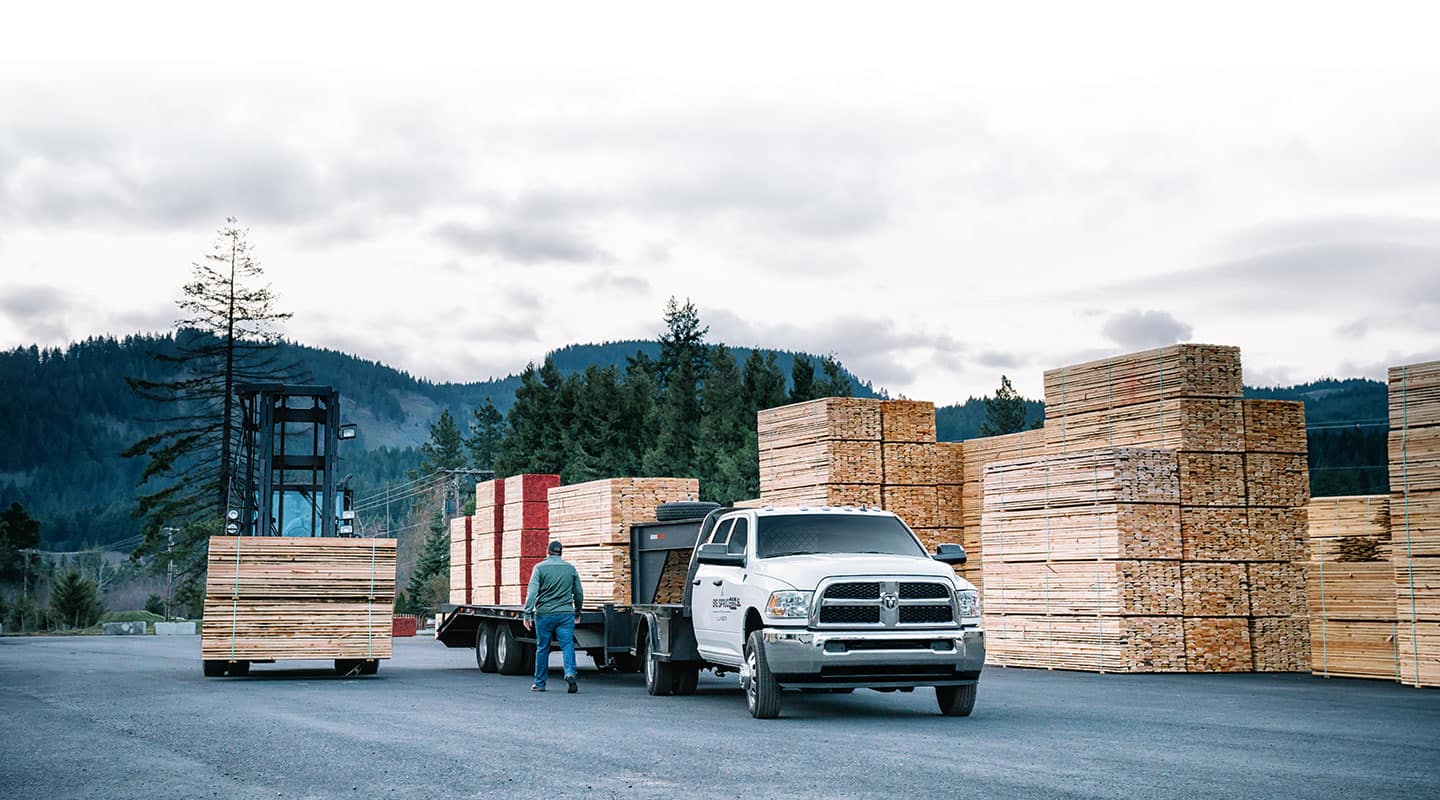 Ram Chassis Cab hauling lumber at a lumber yard.