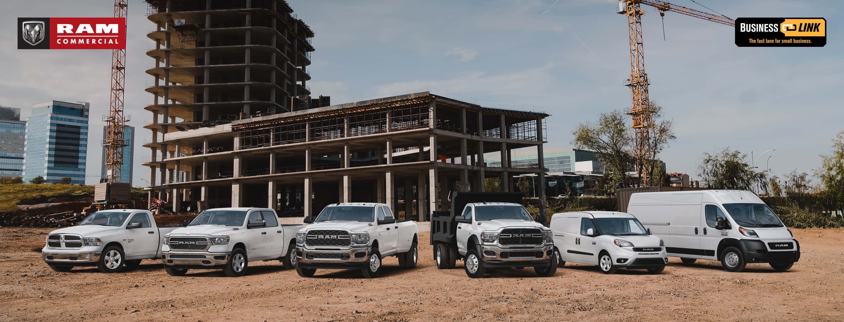 The Ram Commercial logo and BusinessLink logo. Fast lane for small business. The 2021 Ram lineup parked at a commercial construction site. From left to right: four Tradesman models--a Ram 1500 Classic, Ram 1500, Ram 3500 and Ram 5500, followed by a Ram ProMaster City SLT Cargo Van and a Ram ProMaster 2500 Cargo Van.
