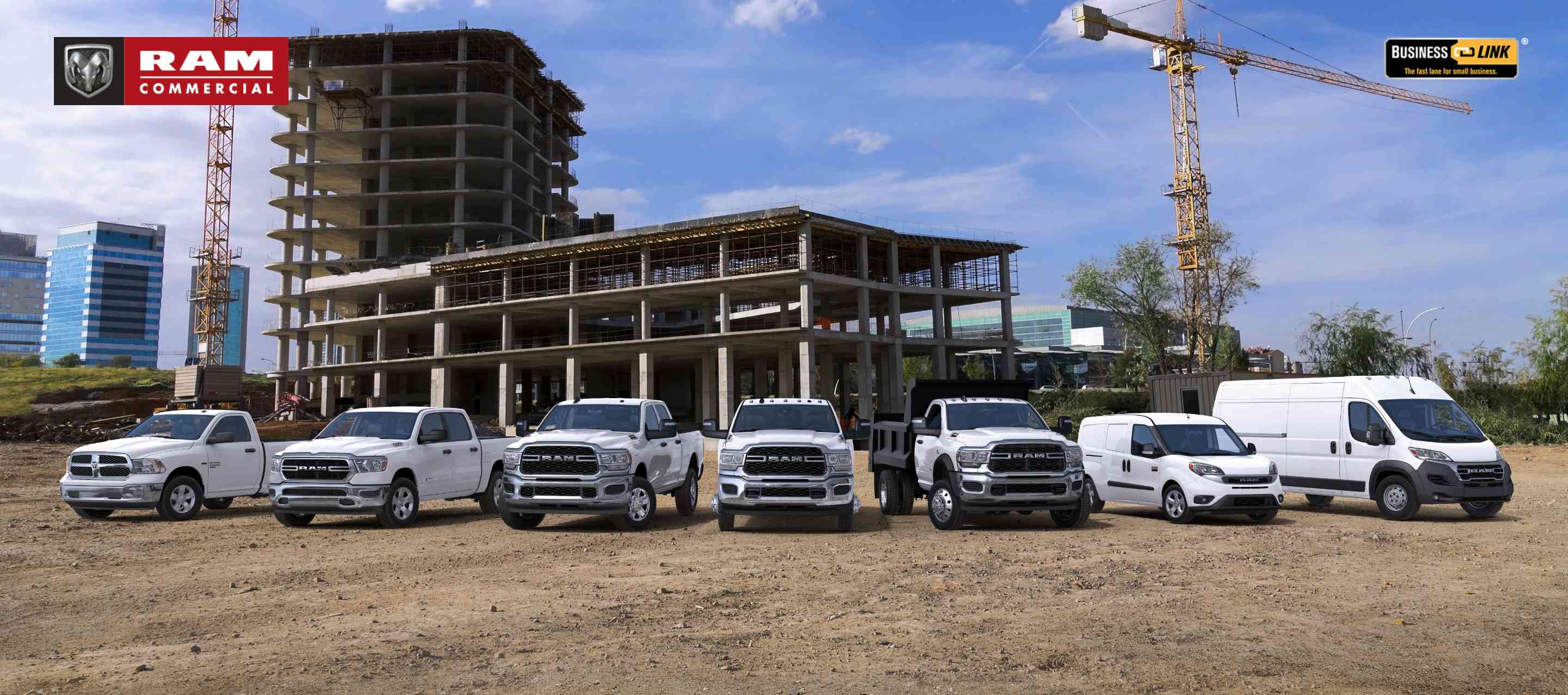 A Ram Brand lineup consisting of, from left to right: a 2023 Ram 1500 Classic Tradesman 4x4 Regular Cab, 2023 Ram 1500 Tradesman 4x4 Crew Cab, 2023 Ram 2500 Tradesman 4x4 Crew Cab, 2023 Ram 3500 Tradesman 4x4 Crew Cab, 2023 Ram 5500 SLT Chassis Cab 4x4 with dump body upfit, 2022 Ram ProMaster City Cargo Van and 2023 Ram ProMaster 3500 Cargo Van High Roof, all in white, parked side-by-side at a construction site. Ram Commercial. Business Link: The fast lane for small business.