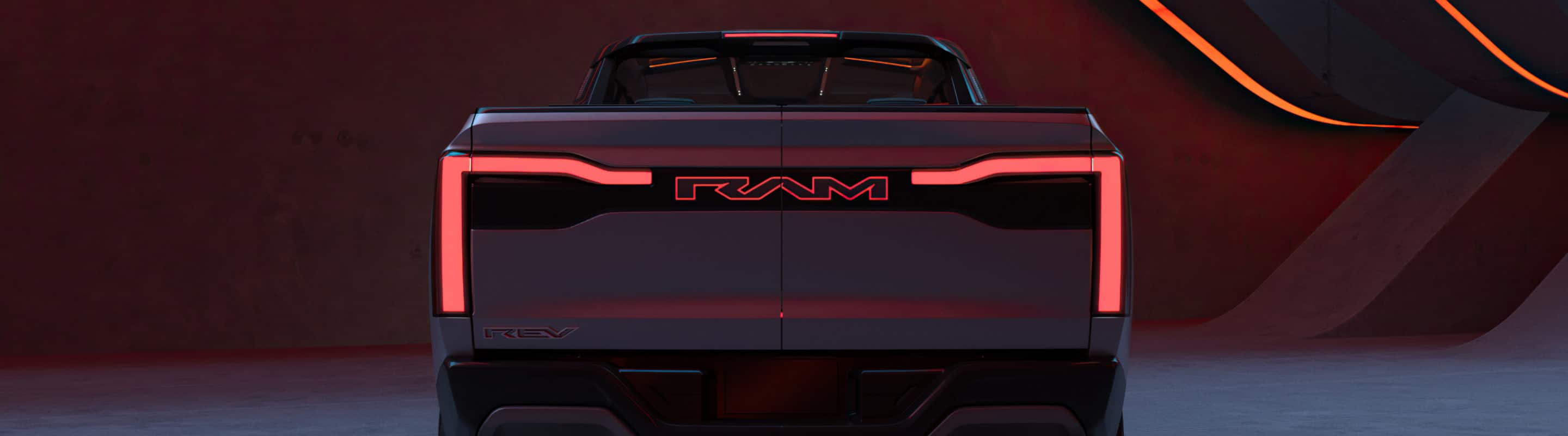 A rear view of the Ram Revolution Concept in a studio with a dramatic set design and lighting.