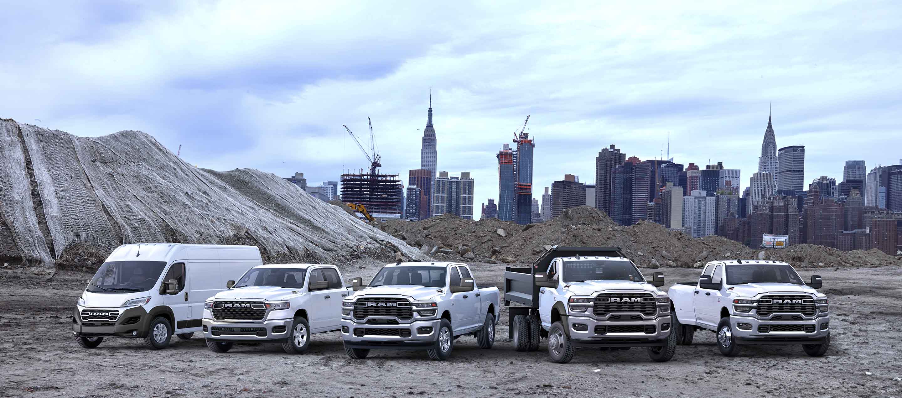 A pack shot showing a Ram Promaster van, Ram 1500 truck, Ram 2500 truck, Ram Chassis Cab truck, and a Ram 3500 truck on a construction site.