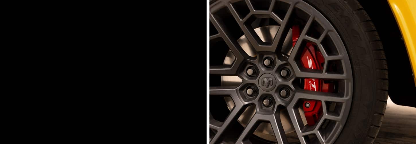 A wheel and red SRT brake caliper on the 2027 Ram 1500 Rumble Bee SRT 4x4 Crew Cab.