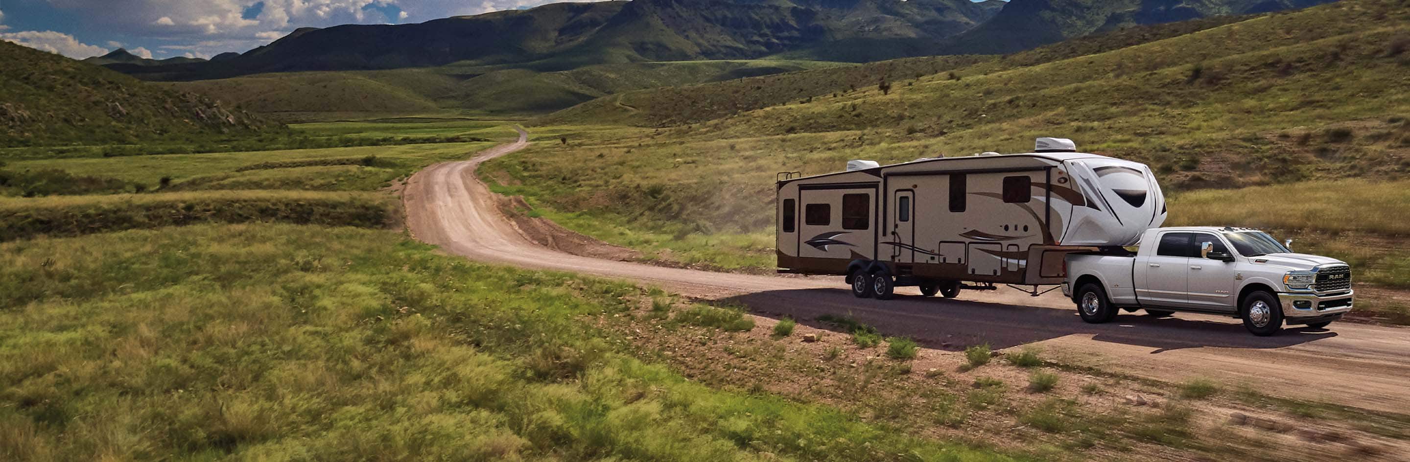 The 2021 Ram 3500 towing a large RV trailer.