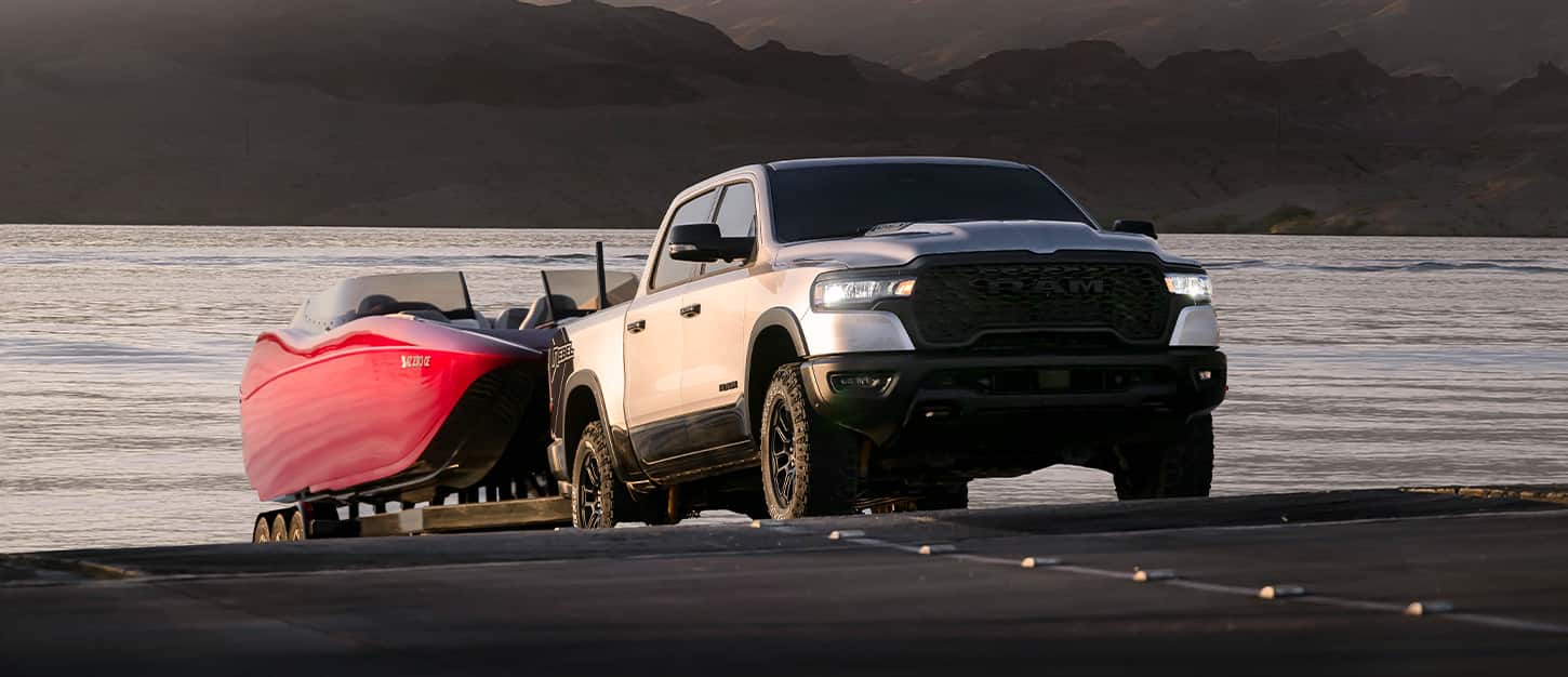 Ram truck towing equipment on a job site