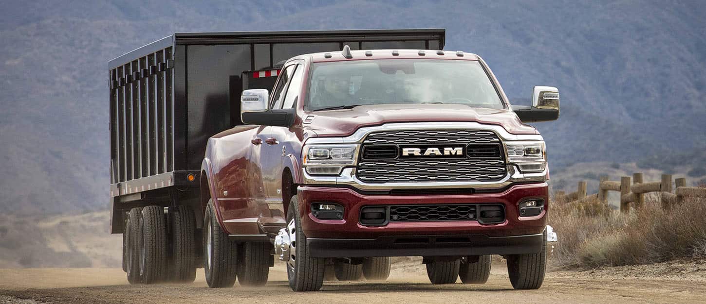 Ram truck hauling cargo through countryside