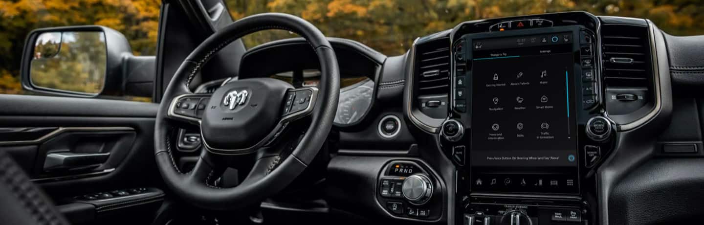 The steering wheel and Uconnect 5C NAV with 12-inch touchscreen in the 2022 Ram 1500 Limited.