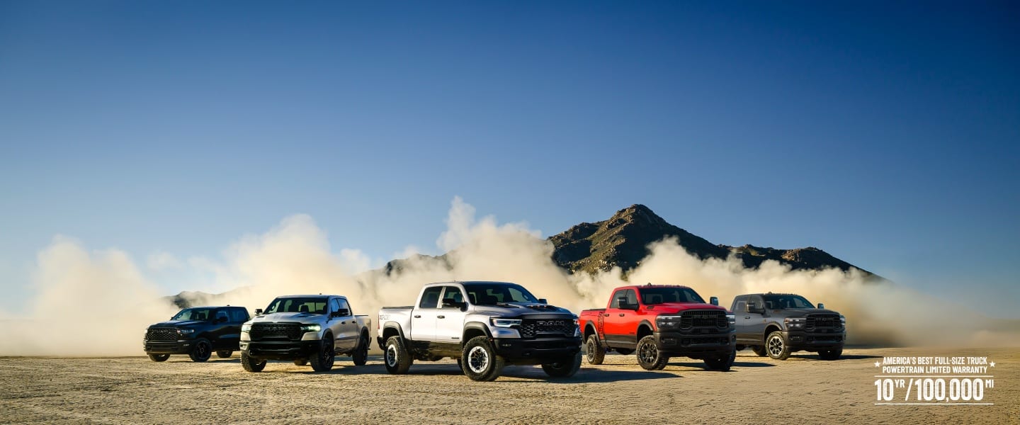 A pack shot of five 2025 Ram Trucks in a desert setting.